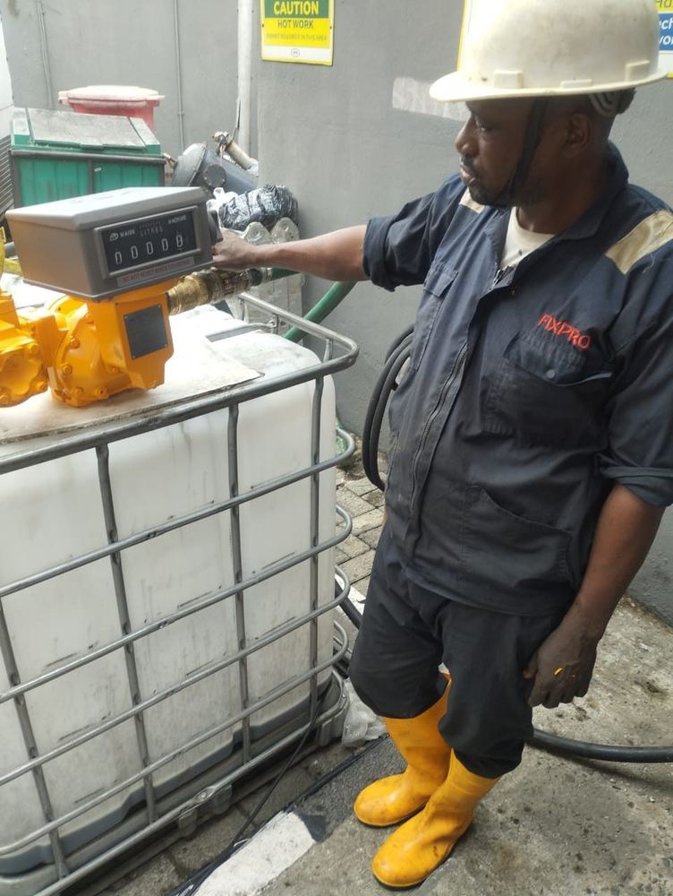 Technician calibrating a positive displacement flowmeter