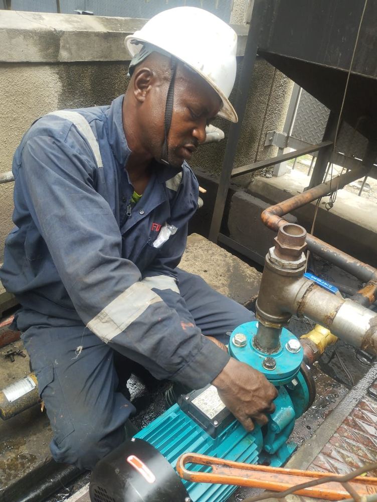 Technician installing an electric fuel transfer pump
